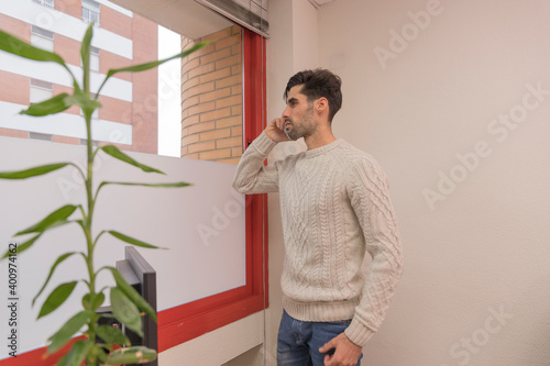 man talking on the phone in an office