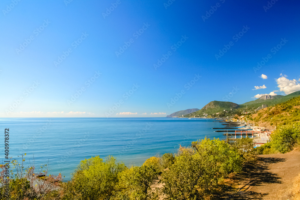 Coastline. Port city on the seashore, seascape. Bay, harbor in the bay. Beautiful sea or ocean with islands. Vacation by the sea