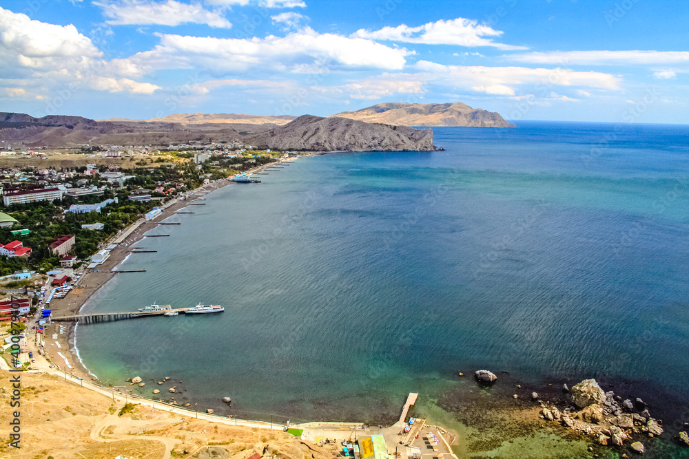 Naklejka premium Coastline. Port city on the seashore, seascape. Bay, harbor in the bay. Beautiful sea or ocean with islands. Vacation by the sea