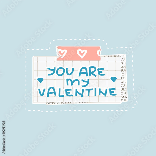 Blue You are my Valentine text on squared paper with dots. A piece of newspaper is at the bottom  pink stationery tape with hearts on the top