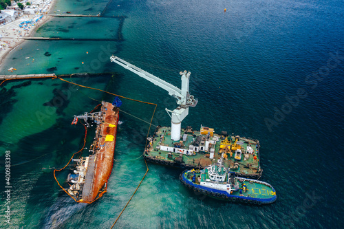 Top view of an old tanker that ran aground and overturned