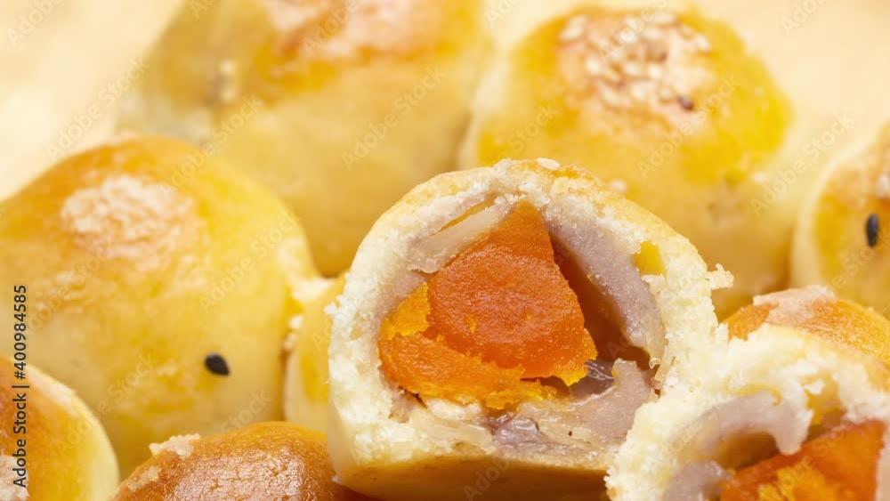 Zoom in Chinese pastry filled with mung bean paste, taro, and salted egg Zoom in Chinese pastry filled with mung bean paste, taro, and salted egg