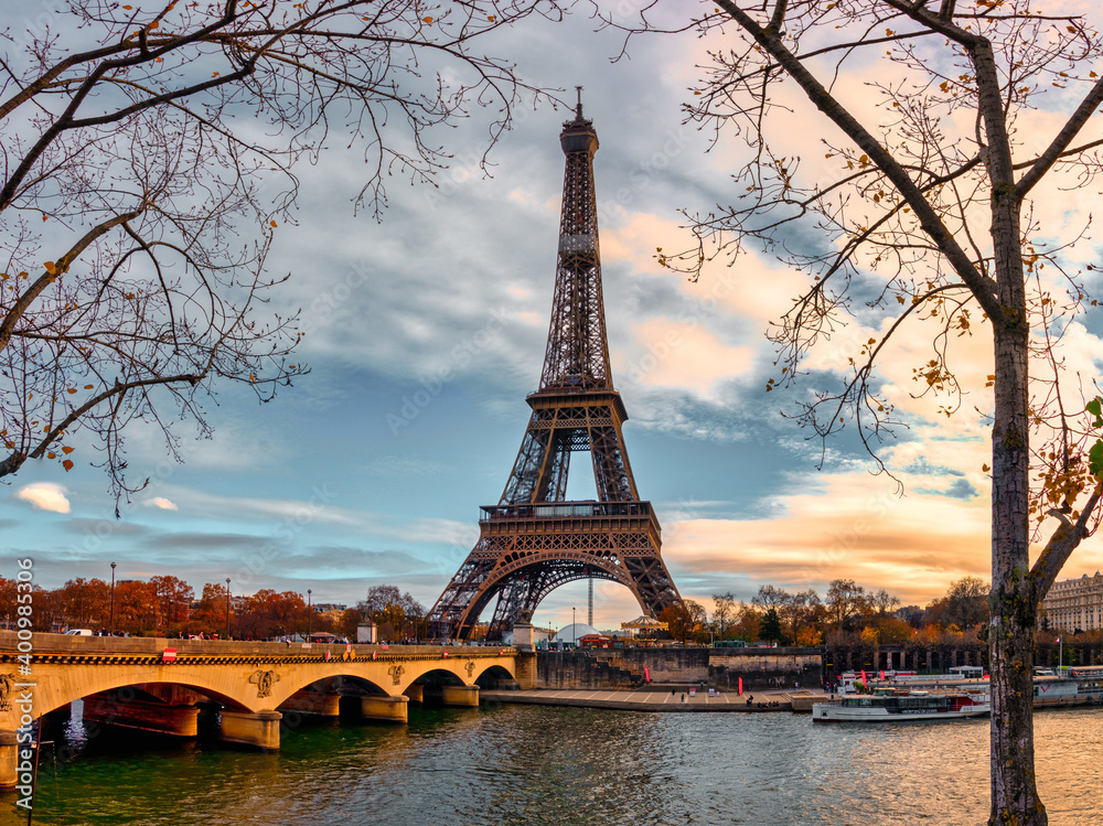 Autumn view over the Seine river with bridge and view towards the Eiffel Tower
