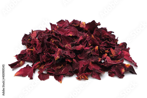 Pile of dried healthy rose petals. Dry red rose petals heap on white.