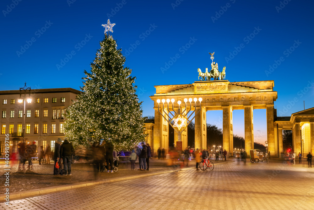Pariser Platz with the main Christmas tree illuminated in the evening in Berlin, Germany