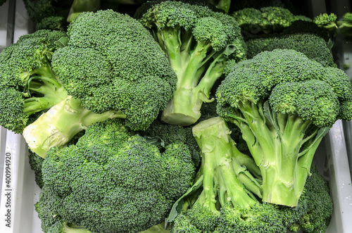 Fresh broccoli on counter farm market. Popular and affordable vegetables in the supermarket. Organic vegetables for vegetarian food.