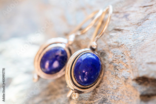 Slika na platnu pair of sterling silver lapis lazuli mineral earrings on natural background