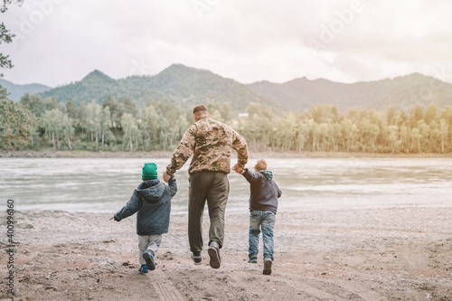 father and two sons having fun outdoors