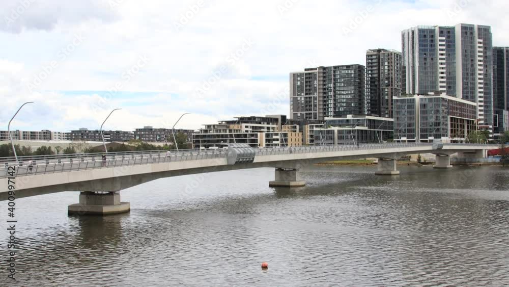 Time-lapse View of Rhodes River and Bridge people and buses going past in Sydney Australia Time-lapse View of Rhodes River and Bridge people and buses going past in Sydney Australia