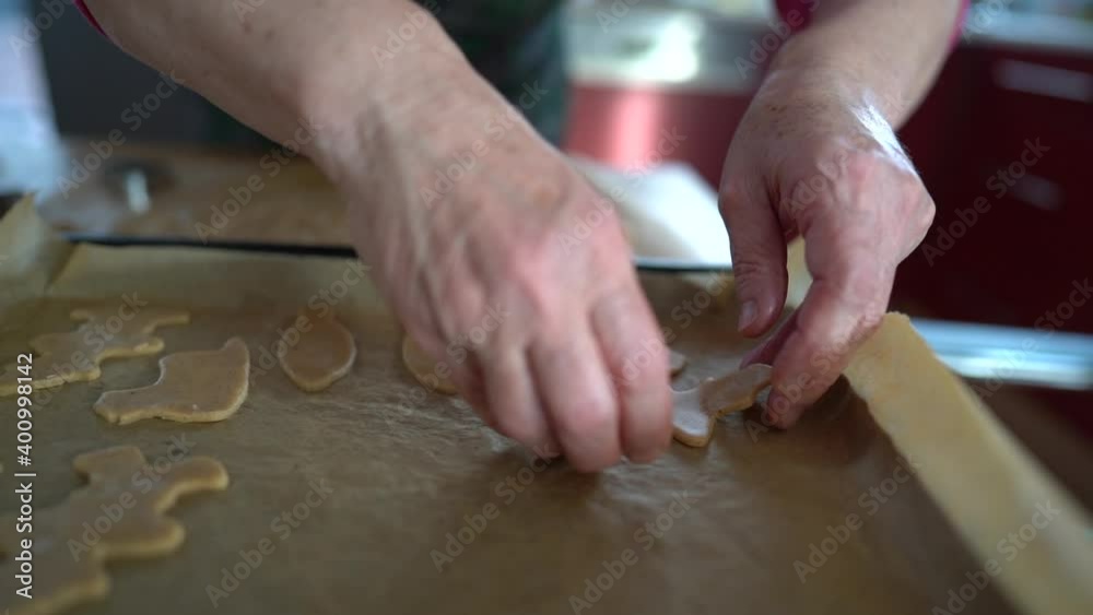 Grandma bakes cookies for grandchildren, christmas gingerbread cookies. Homemade cakes, family traditions Grandma bakes cookies for grandchildren, christmas gingerbread cookies. Homemade cakes, family traditions
