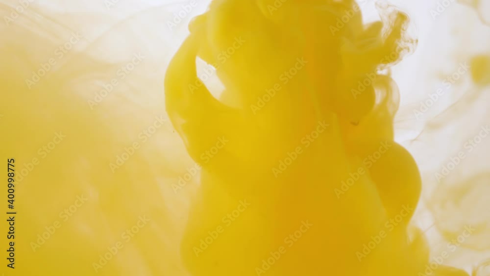 drop yellow ink paint in water slow motion