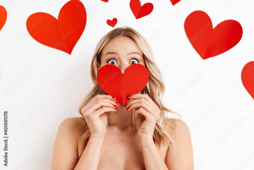 Shocked beautiful girl in red dress smiling and looking at camera Shocked beautiful girl in red dress smiling and looking at camera