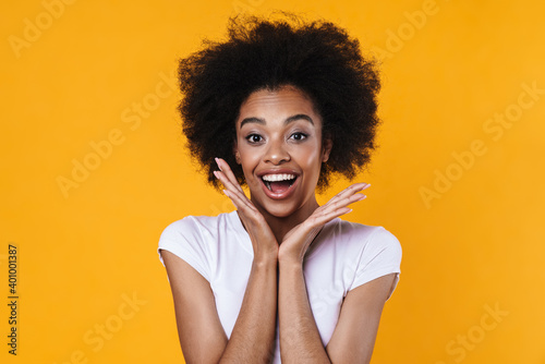 Excited african american girl expressing surprise at camera