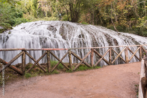 Beautiful shot of the waterfalls in the historical garden park of the Stone Monastery in Nuevalos, photo