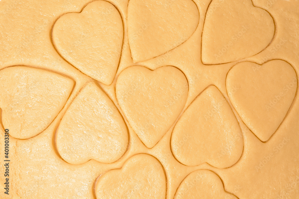dough for heart cookies for Valentine's day, ingredients for baking for the holiday. decorative hearts top view dough for heart cookies for Valentine's day, ingredients for baking for the holiday. decorative hearts top view