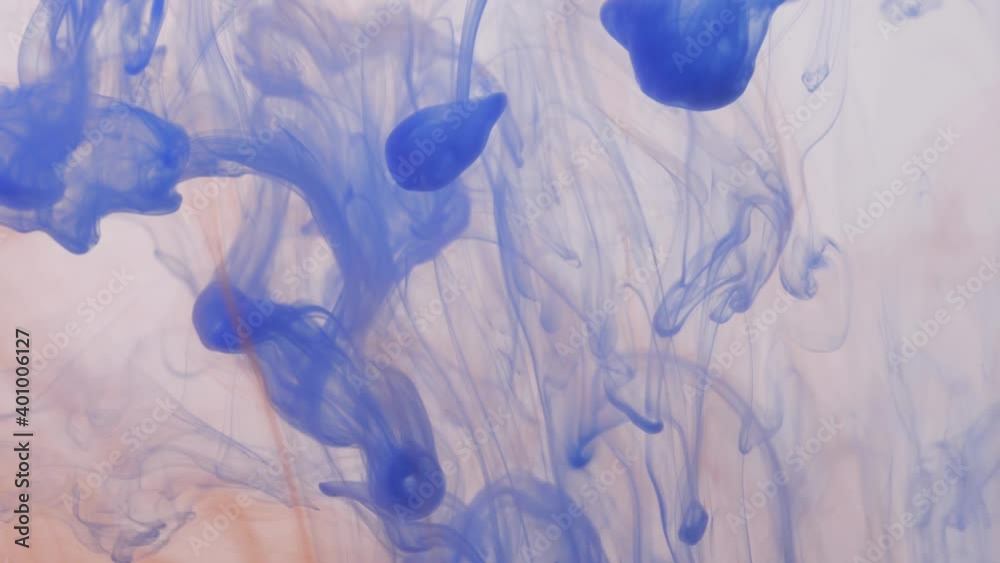 drop blue ink on orange ink paint in water slow motion