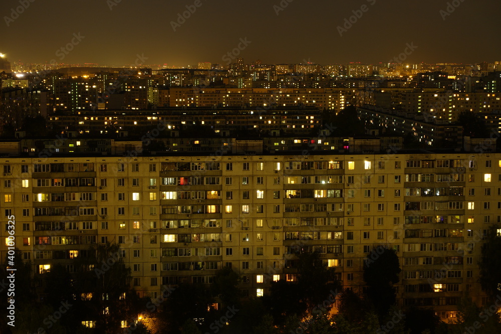 Light in the houses of the sleeping area at night. Moscow, Russia.