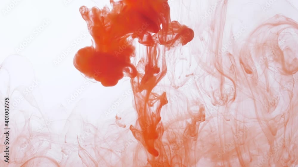 drop orange ink paint in water slow motion
