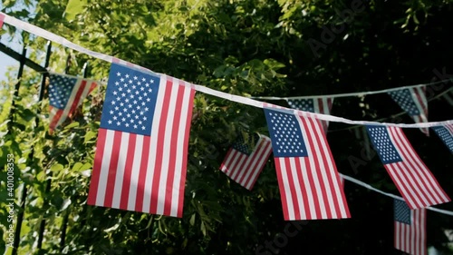 American flags hanging on a decoration outside