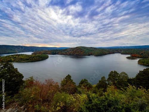 Beautiful Hawn’s Overlook of Raystown Lake in the mountains of Pennsylvania, right before sunset with the sky swirled with blue, pink, purple and orange and the water smooth as glass.