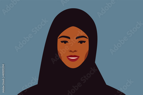 Smiled Arabian woman with a black hijab looks directly. Business young Muslim female wears scarf portrait front view on a blue background. Vector illustration.