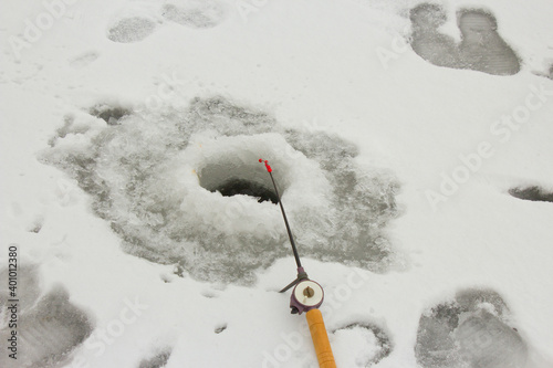 fishing with ice fishing rods  in the oles photo