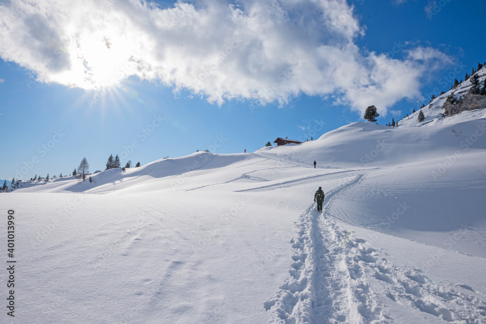 winter hiker at mountain trail in snowy landscape Rofan, austrian alps