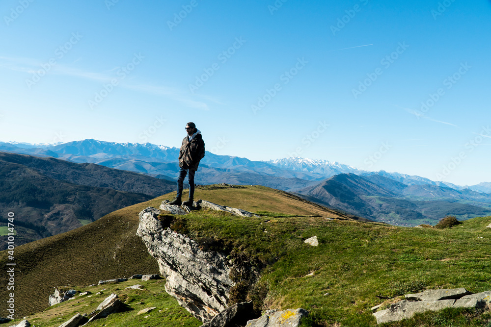 Young man posing after a mountain walk Young man posing after a mountain walk