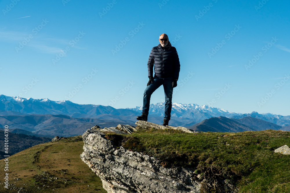 60 years old man posing after a mountain walk