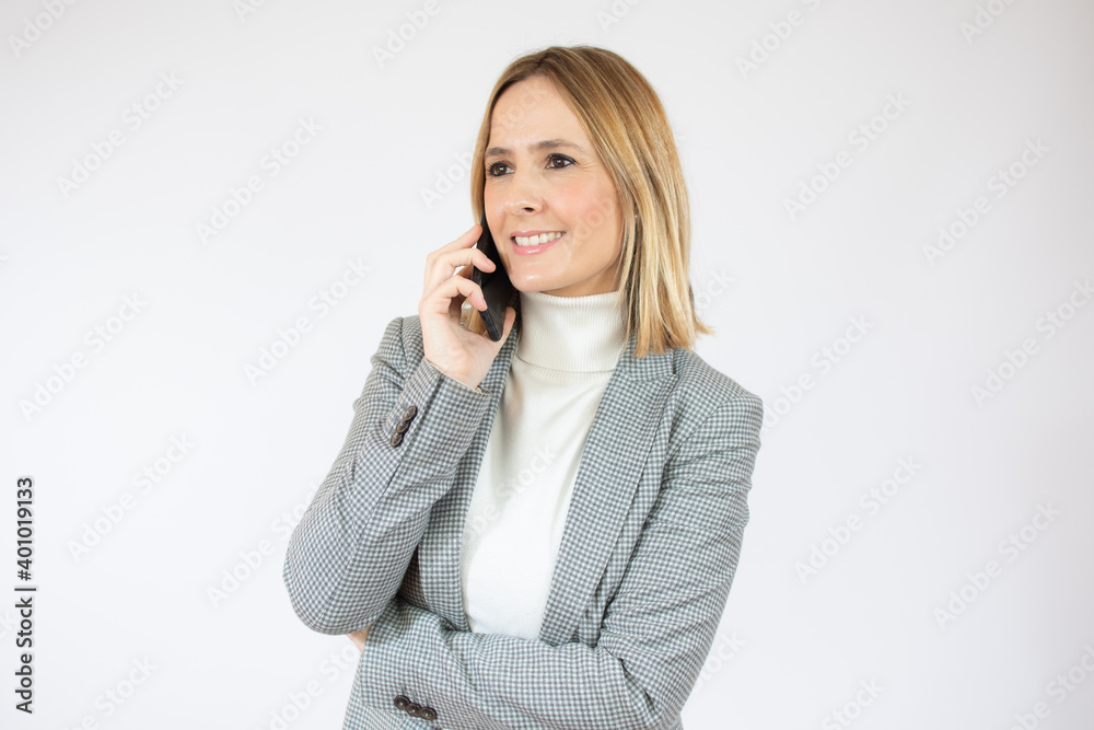 Cheerful young woman talking on mobile phone isolated on white background Cheerful young woman talking on mobile phone isolated on white background