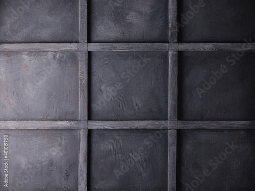Gray loft wall. Closed window shutters. Wood texture
