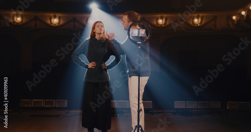 Man and woman showing articulation exercises for actors photo