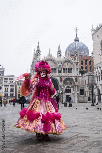 Venice, Italy - February 17, 2020: An unidentified woman in a carnival costume in Piazza San Marco attends at the Carnival of Venice.