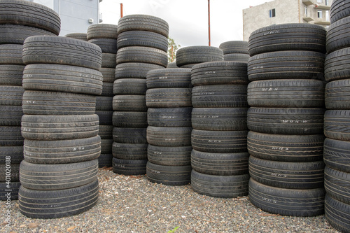 Stack of old used car tires on the ground