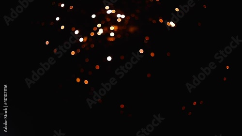 Golden Fireworks with particles and sparks in the black night sky. For 4th of July, festival, Anniversary, Celebration, Party, New Year, Happy Birthday, Wedding, Confetti, Diwali, Christmas