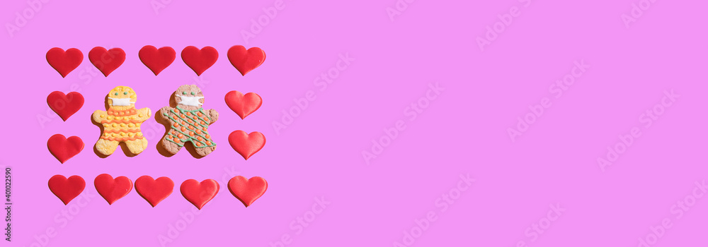 Banner with a couple in love in protective masks with hearts on a pink background. The concept of celebrating Valentine's Day. Copy space Banner with a couple in love in protective masks with hearts on a pink background. The concept of celebrating Valentine's Day. Copy space