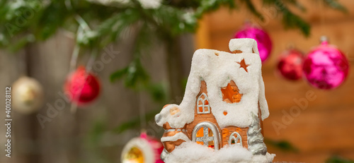 Decorative snow house-candlestick on the Christmas tree