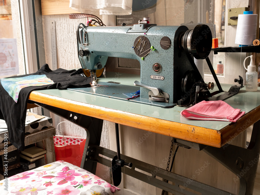 ANTIQUE SEWING MACHINE AND SEAMSTRESS WORKSPACE