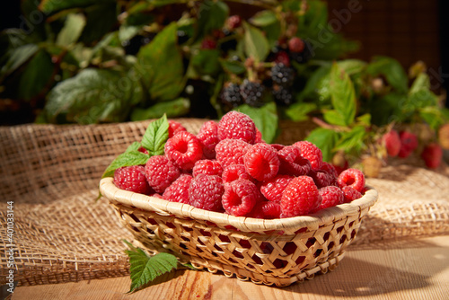Blackberry with raspberries on a wooden background