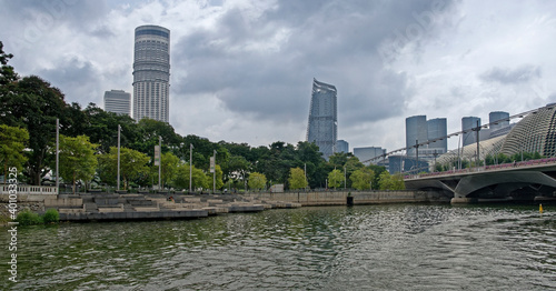 ew of Esplanade Park and Esplanade Theatres from Singapore River.People walk in the park