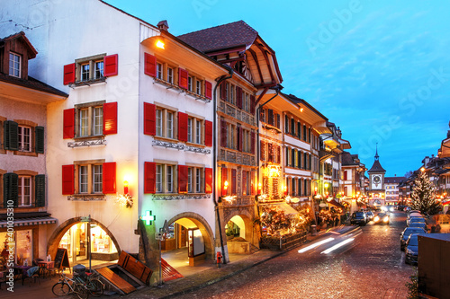 Historic houses dressed up for Christmas in the old town of Murten / Morat, Canton de Fribourg, Switzerland