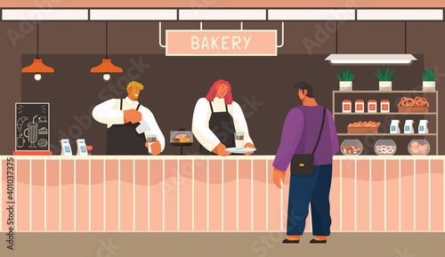 Man choose cakes and buy coffee at bakery shop. Male and female sellers in uniform in bakery interior serves male customer. Confectionery store assortment cakes, sweets, donuts and furnishings