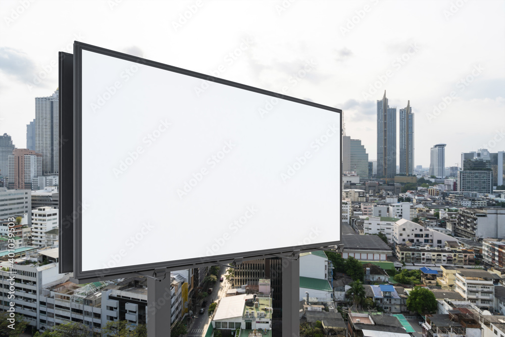 Blank white road billboard with Bangkok cityscape background at day time. Street advertising poster, mock up, 3D rendering. Side view. The concept of marketing communication to promote or sell idea. Blank white road billboard with Bangkok cityscape background at day time. Street advertising poster, mock up, 3D rendering. Side view. The concept of marketing communication to promote or sell idea.