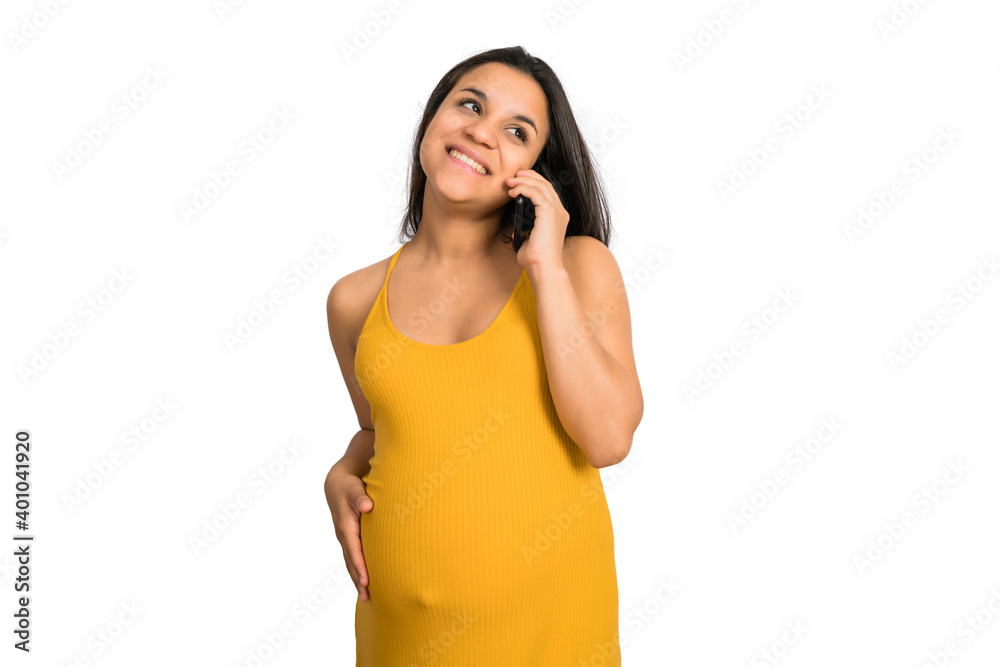 Pregnant woman talking on the phone. Pregnant woman talking on the phone.