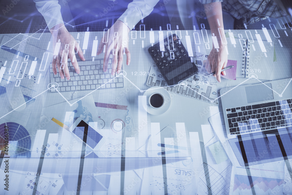 Double exposure of man and woman working together and financial chart hologram drawing. market analysis concept. Computer background. Top View. Double exposure of man and woman working together and financial chart hologram drawing. market analysis concept. Computer background. Top View.
