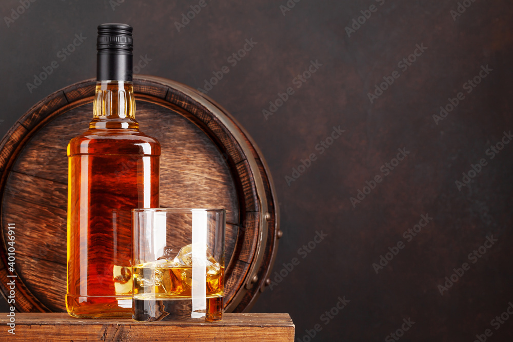 Scotch whiskey bottle, glass and old barrel Scotch whiskey bottle, glass and old barrel