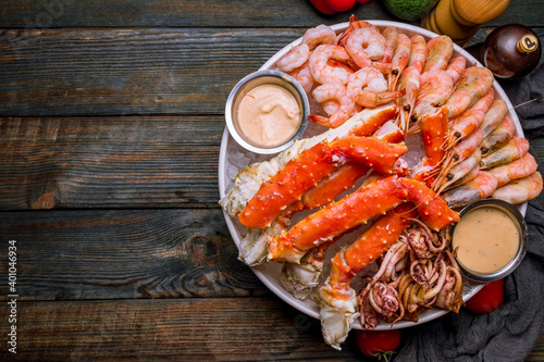 assorted seafood on ice, crab, shrimps, prawns, squid