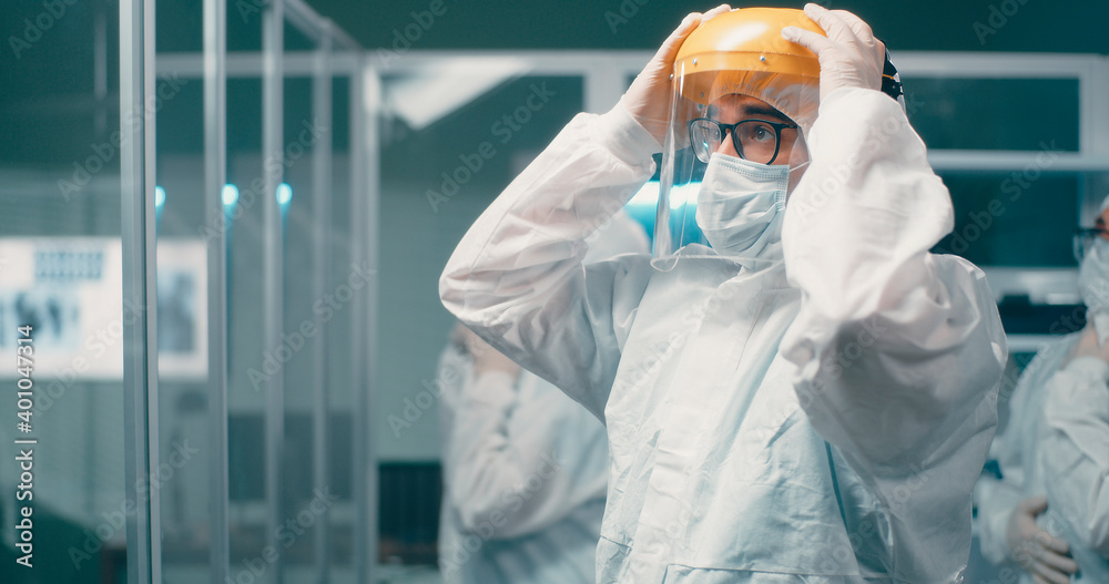 Doctors preparing to work with infected patients Doctors preparing to work with infected patients