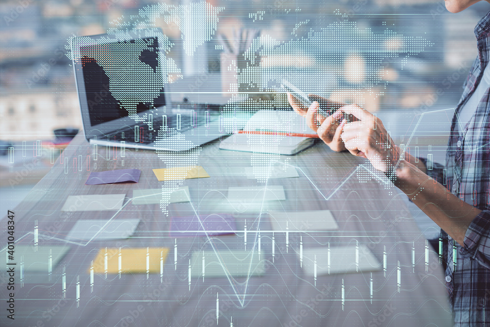 Double exposure of woman hands working on computer and forex graph hologram drawing. Financial analysis concept. Double exposure of woman hands working on computer and forex graph hologram drawing. Financial analysis concept.