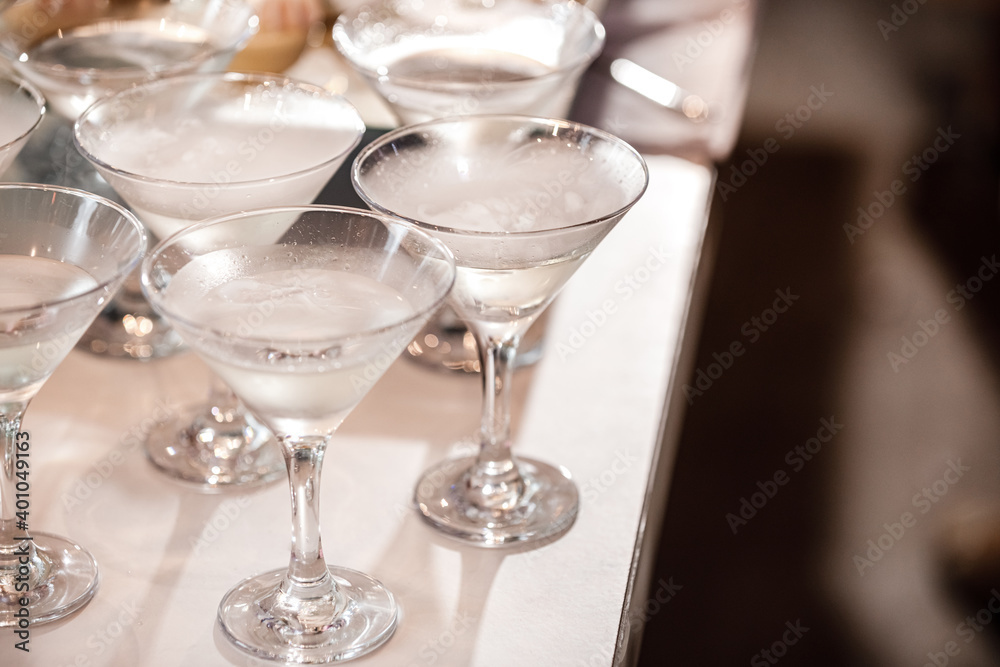 alcoholic beverage in martini glasses with dry ice